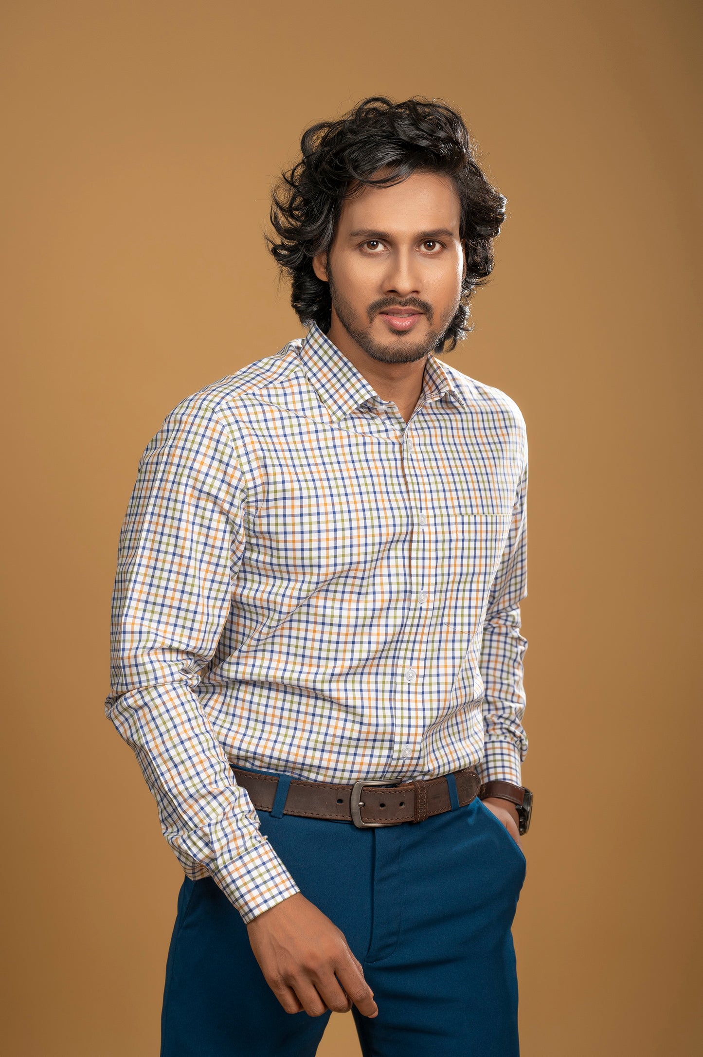 Multicolor check shirt on a man, showcasing vibrant blue, green, and orange against a white background, perfect for men's fashion.