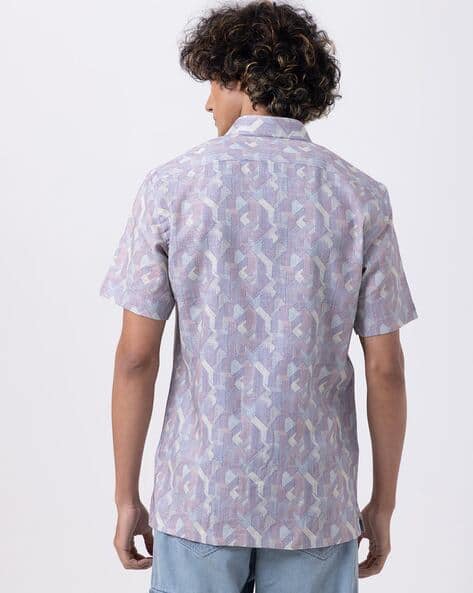 Men's blue abstract print slim fit half sleeve shirt, stylish design perfect for relaxed outings.
