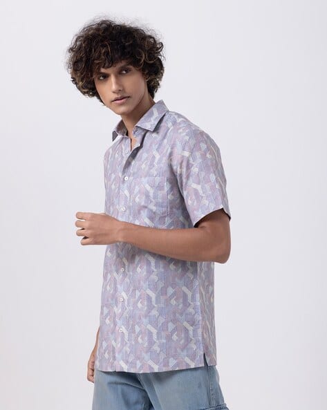 Men's fashion abstract print slim fit half sleeve shirt in blue tones, perfect for stylish summer outings.