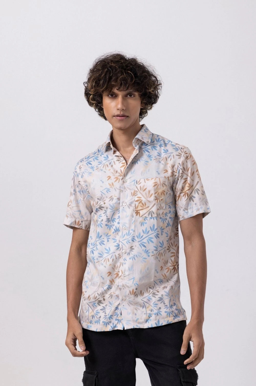 Man wearing Leaf Printed Satin Slim Fit Shirt, showcasing a stylish modern design with a luxurious satin finish.