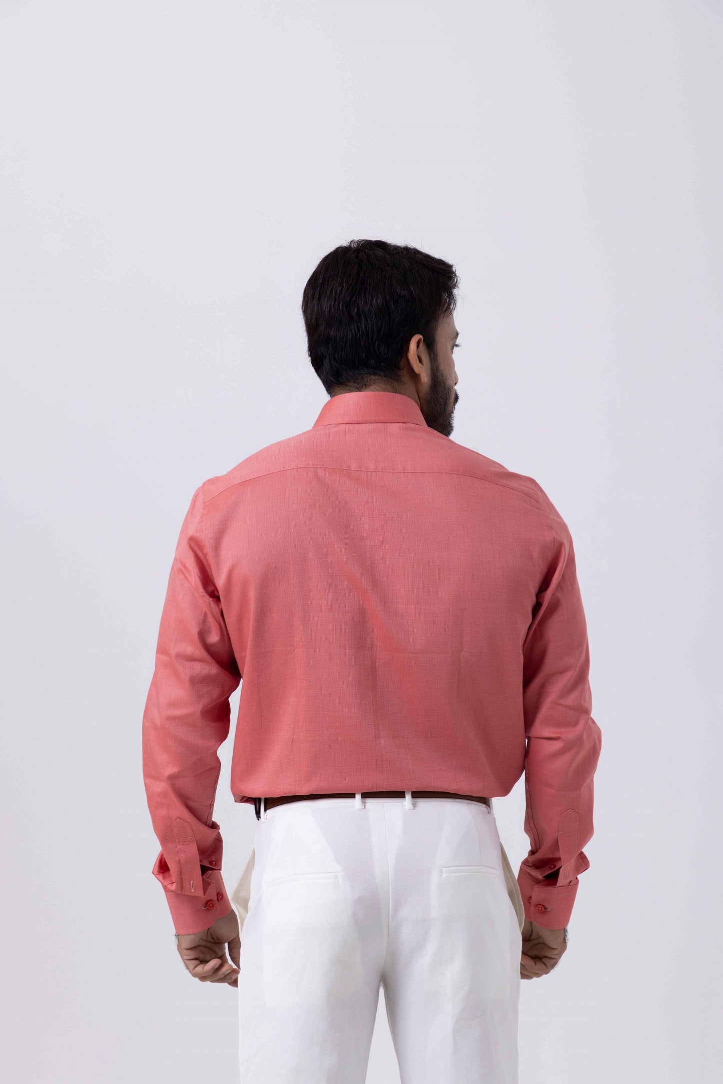 Back view of a man wearing a Premium Giza Cotton red shirt, showcasing its elegant fit and modern design.