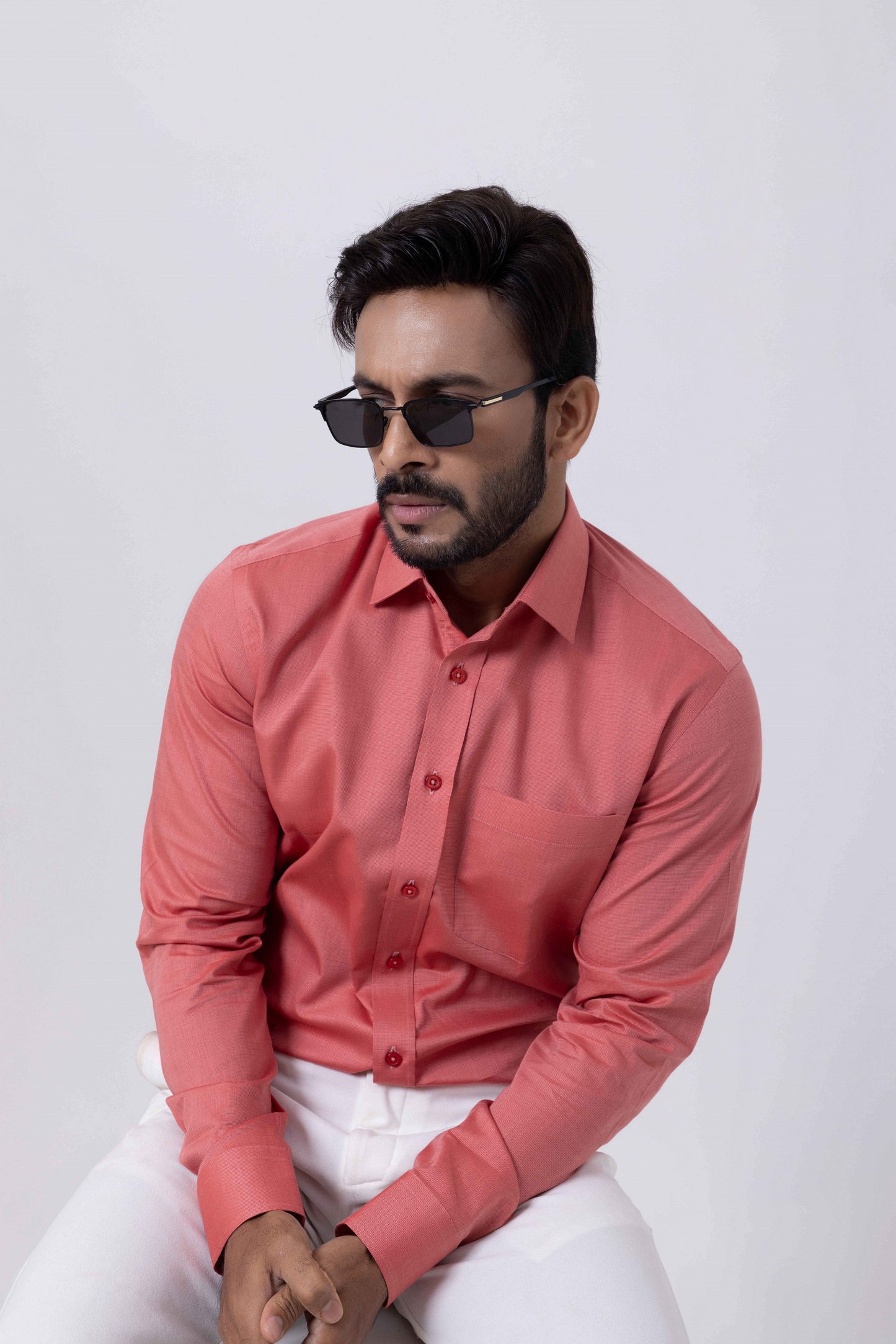 Man wearing a Premium Giza Cotton red shirt with sunglasses, showcasing style and comfort.