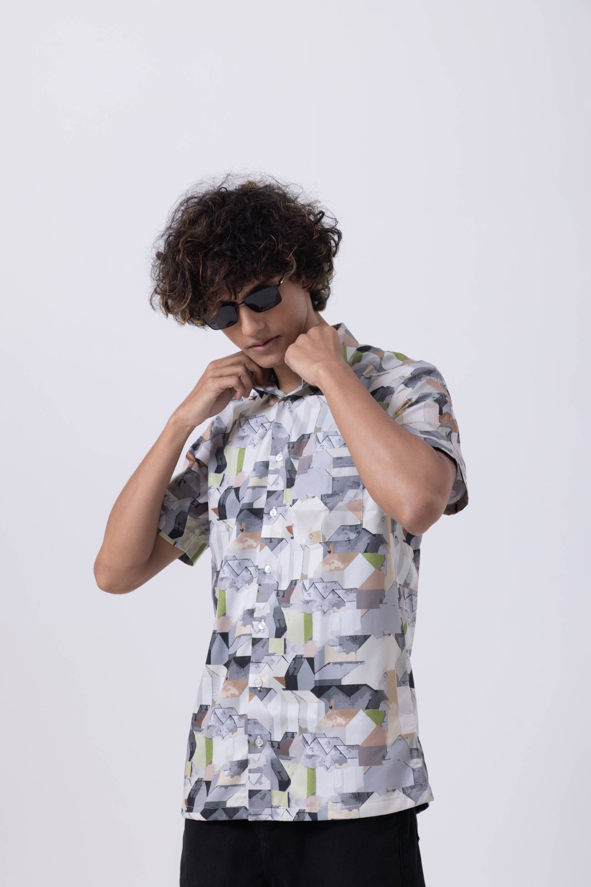 Men's multicolor abstract print slim fit shirt, styled for modern professionals in a casual setting.