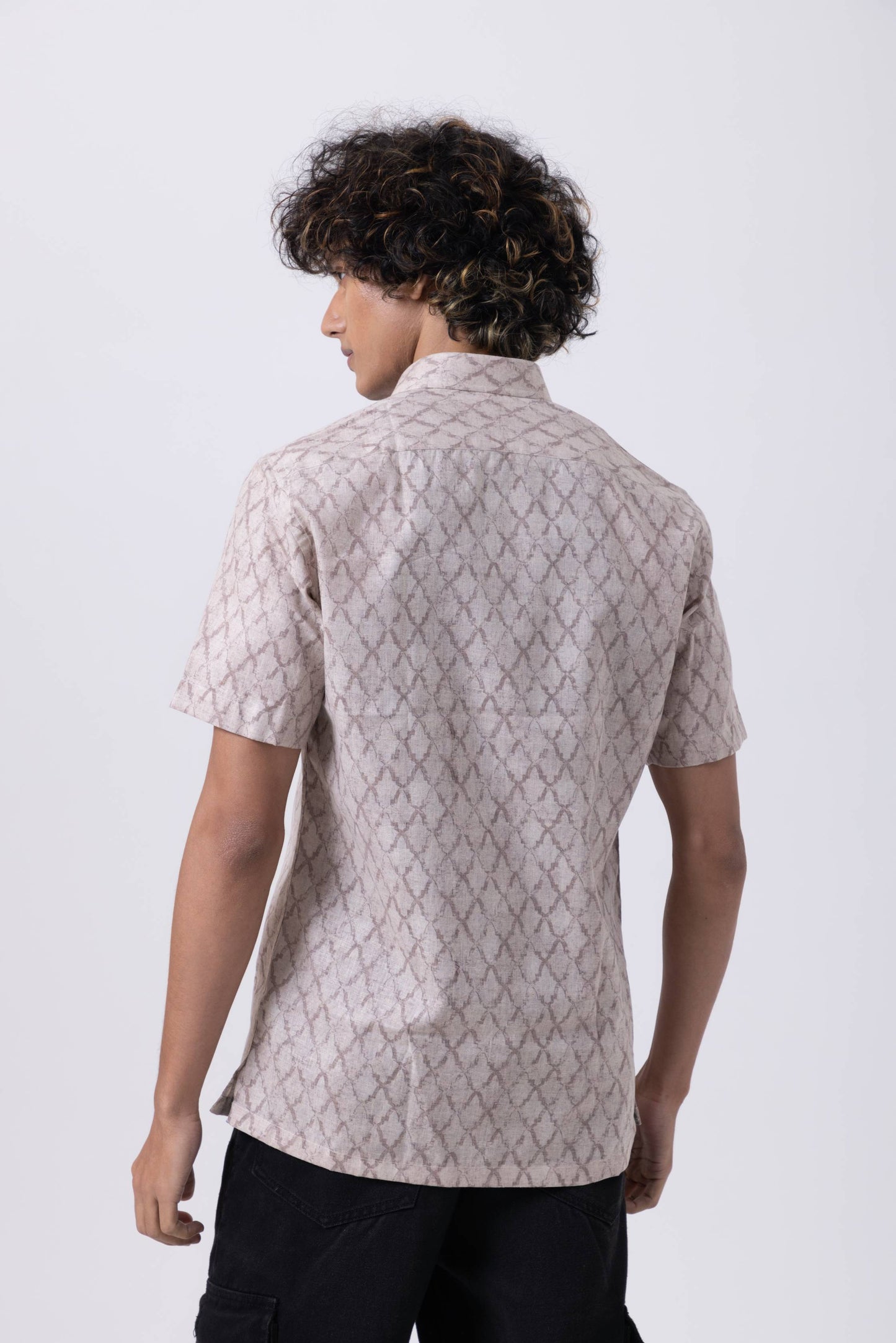 Back view of a man in a stylish Down Collar Slim Fit Shirt in melange fabric, showcasing modern elegance and comfort.