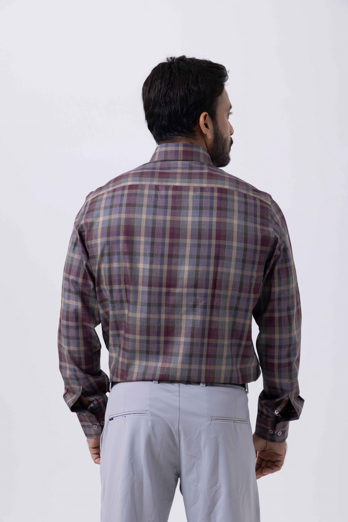 Back view of a man wearing a violet checkered regular fit Giza cotton shirt by Tailors Cove.