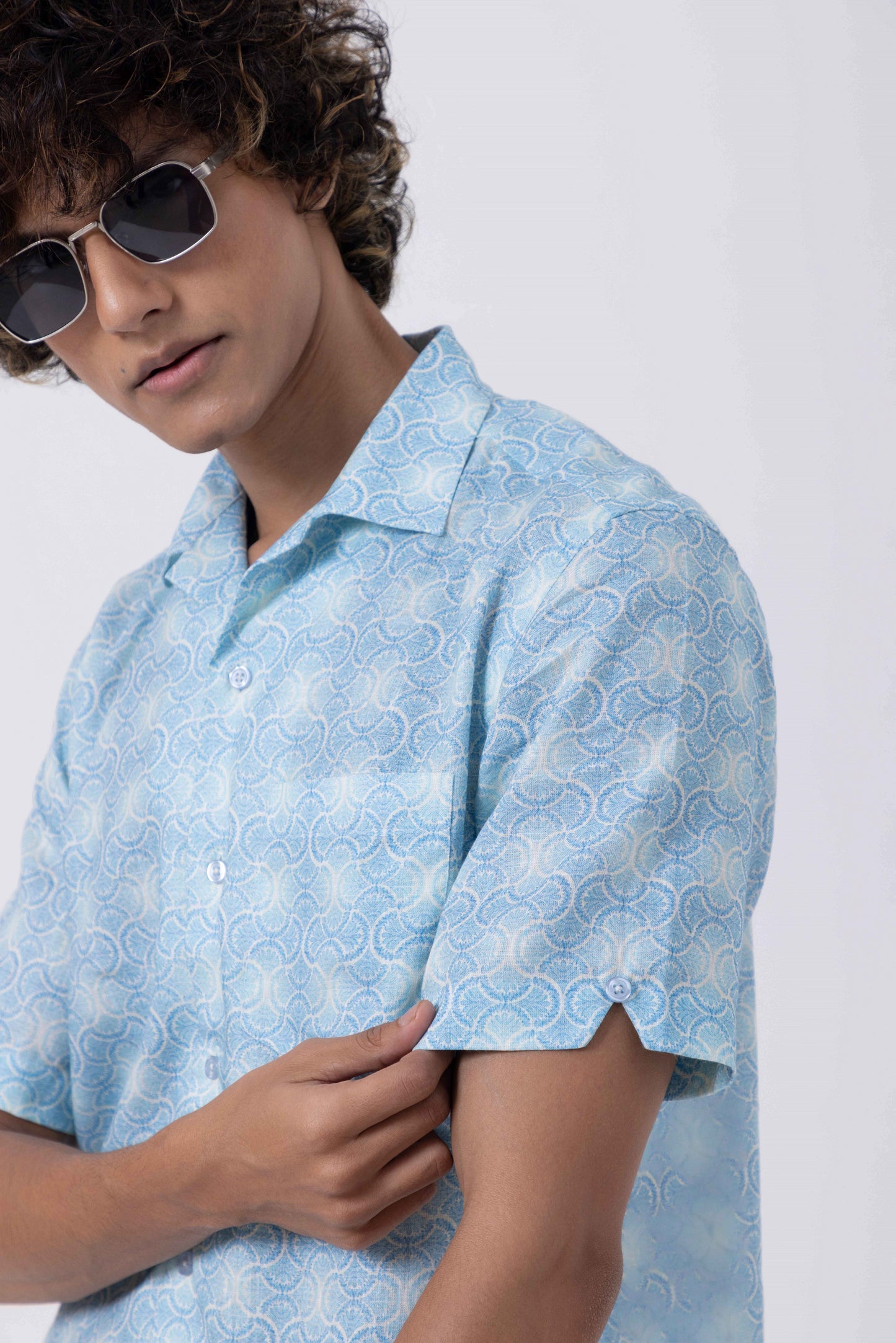 Model wearing Vintage Print Open Collar Regular Fit Shirt in light blue, showcasing a relaxed yet stylish look for men.