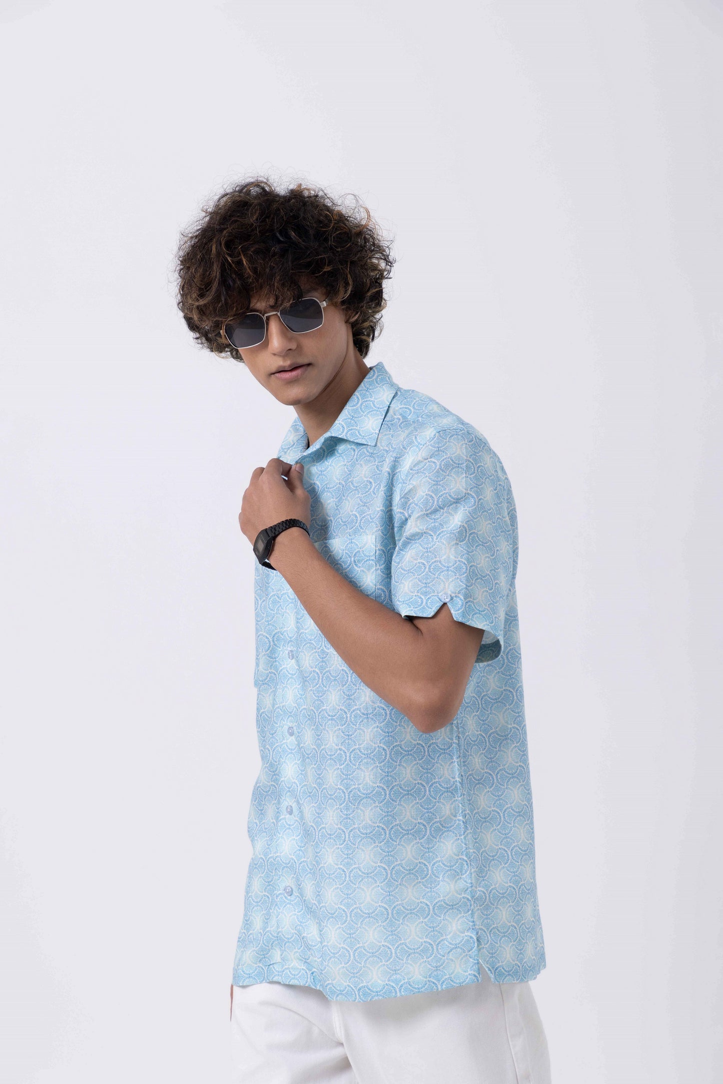 Model wearing a Vintage Print Open Collar Regular Fit Shirt in light blue, showcasing a stylish summer look.