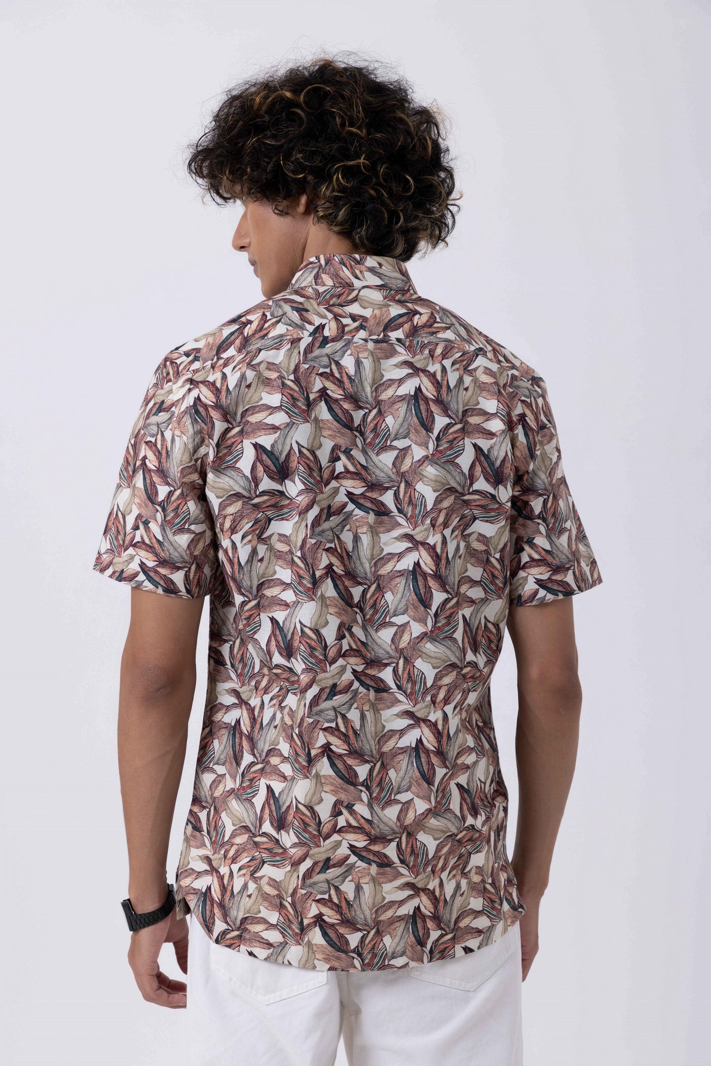 Back view of a Men's Seasonal Print Down Collar Slim Fit Shirt in a stylish leaf pattern.