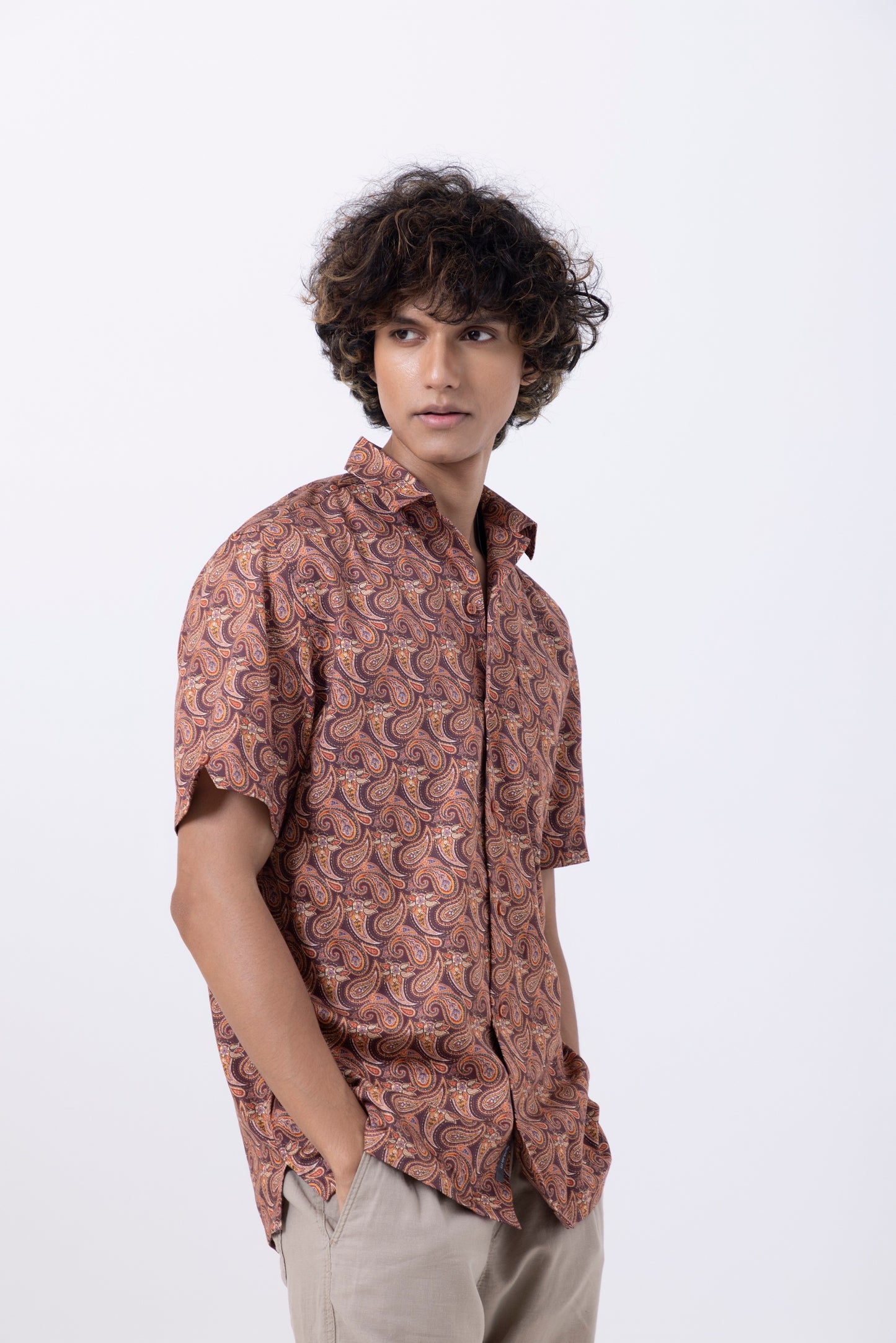Men's slim fit shirt with an abstract rust print, showcasing modern style and elegance.