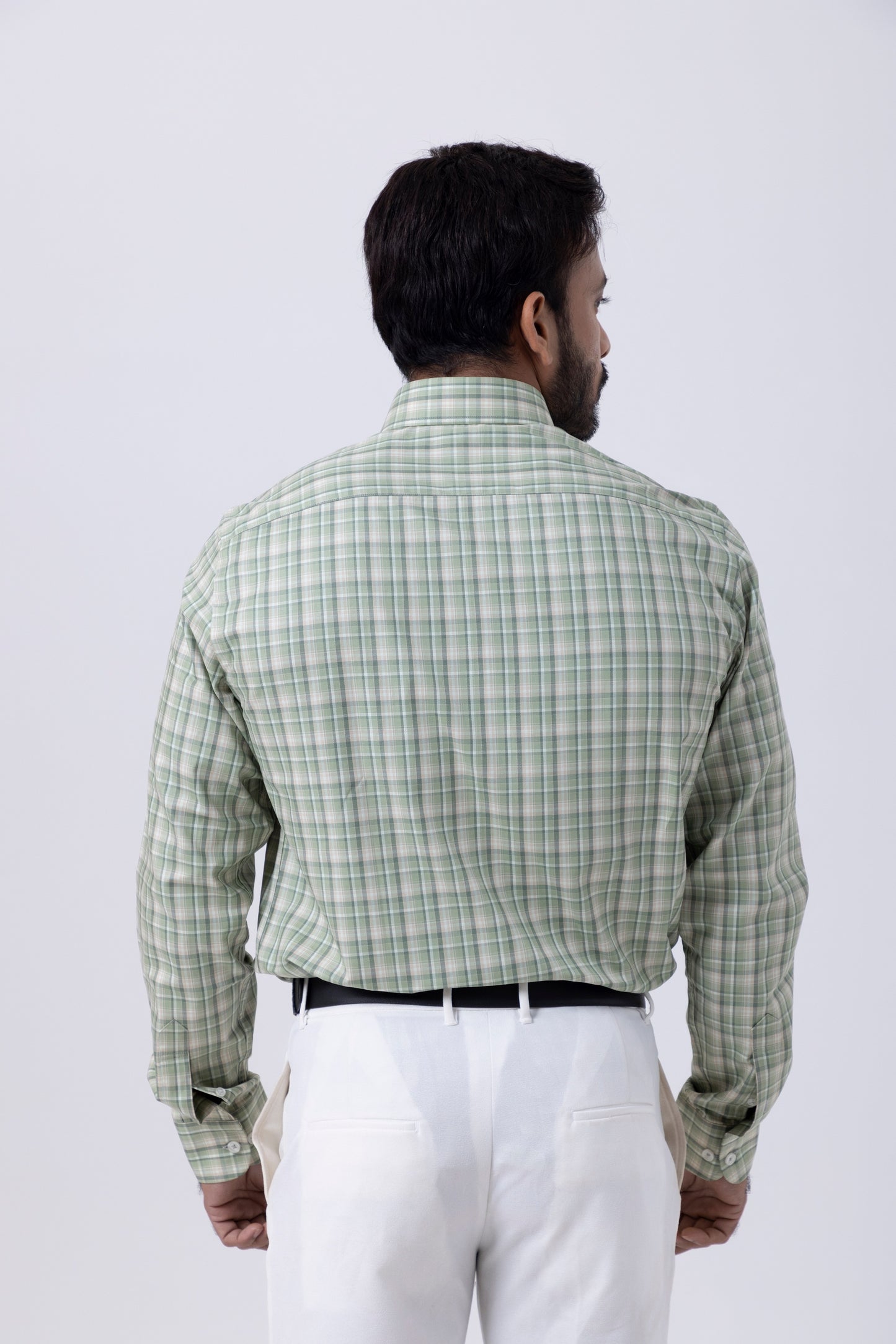 Back view of a man wearing an elegant green and white checkered shirt, showcasing its classy design and fit.