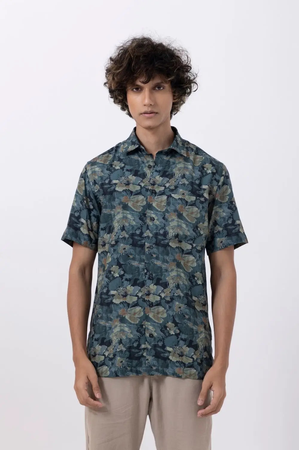Men's jungle print half-sleeve shirt in teal, featuring a modern slim fit and stylish design for men's fashion.