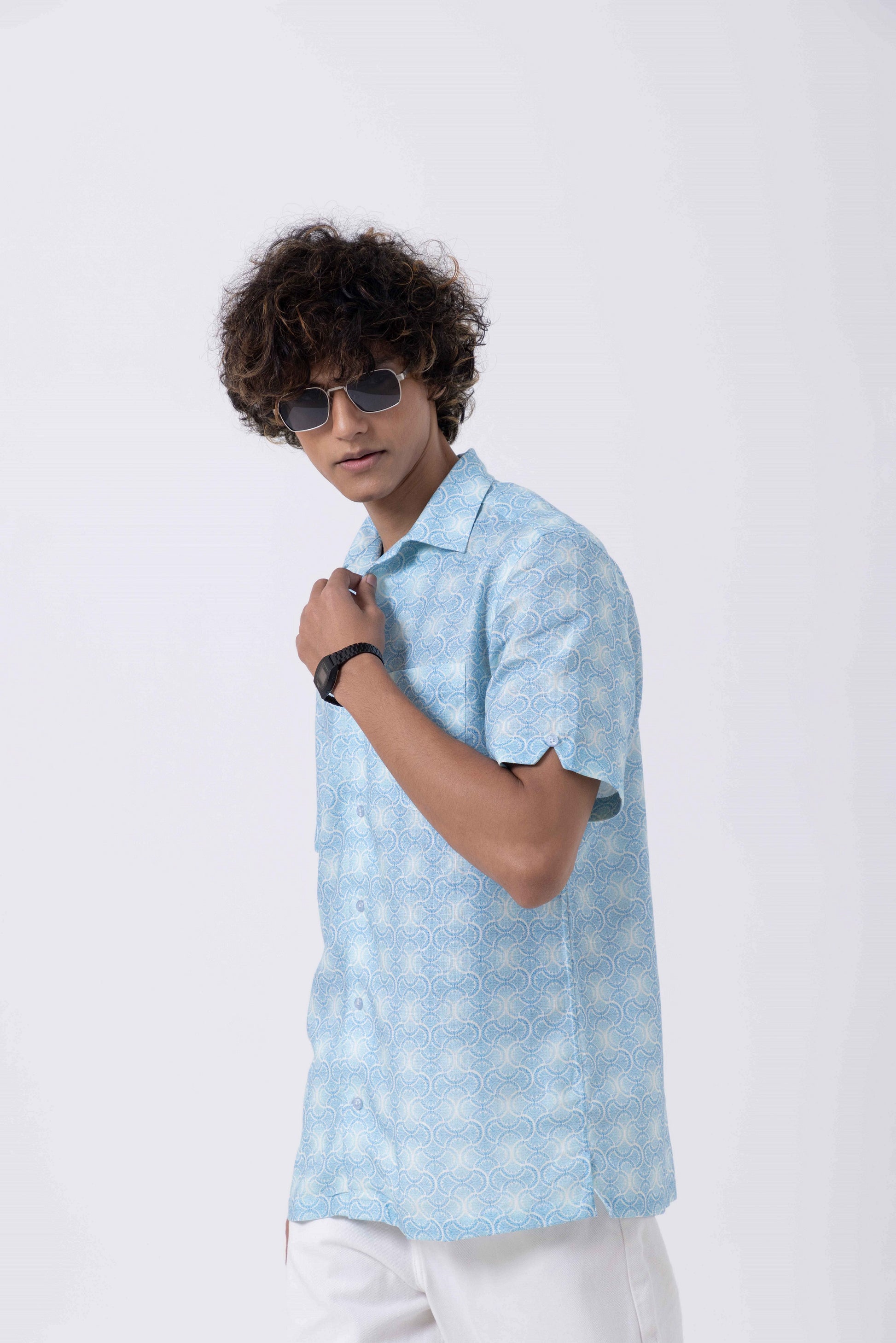 Model wearing a Vintage Print Open Collar Regular Fit Shirt in light blue, showcasing a stylish summer look.