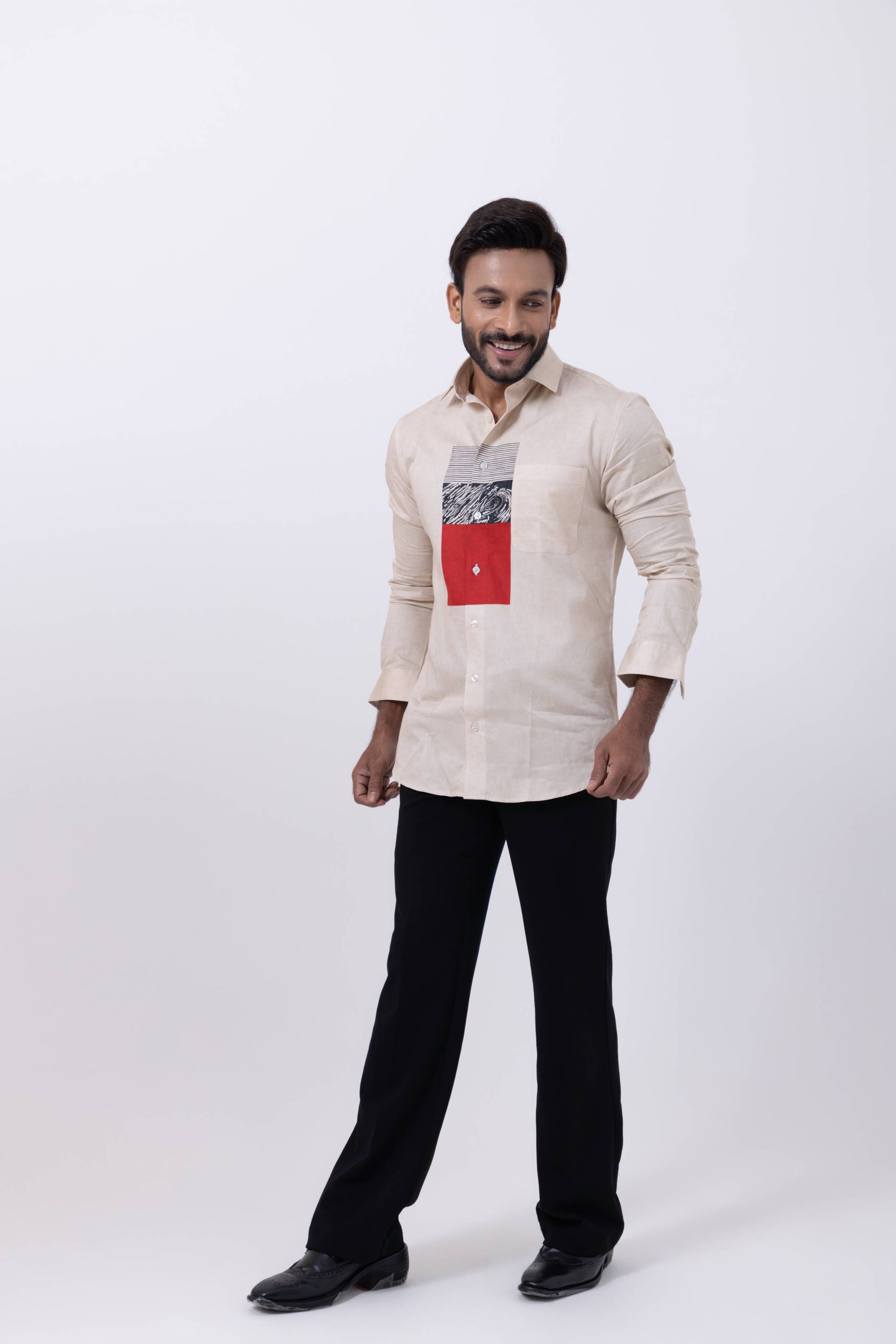 Men's fashion with a model in an off white designer Giza cotton shirt, featuring a printed pattern and black pants.